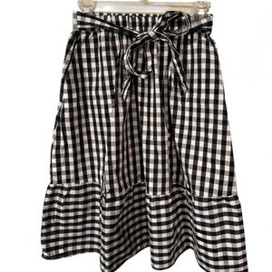Checkered mid-length skirt with waist bow and pockets - fits both XS and S